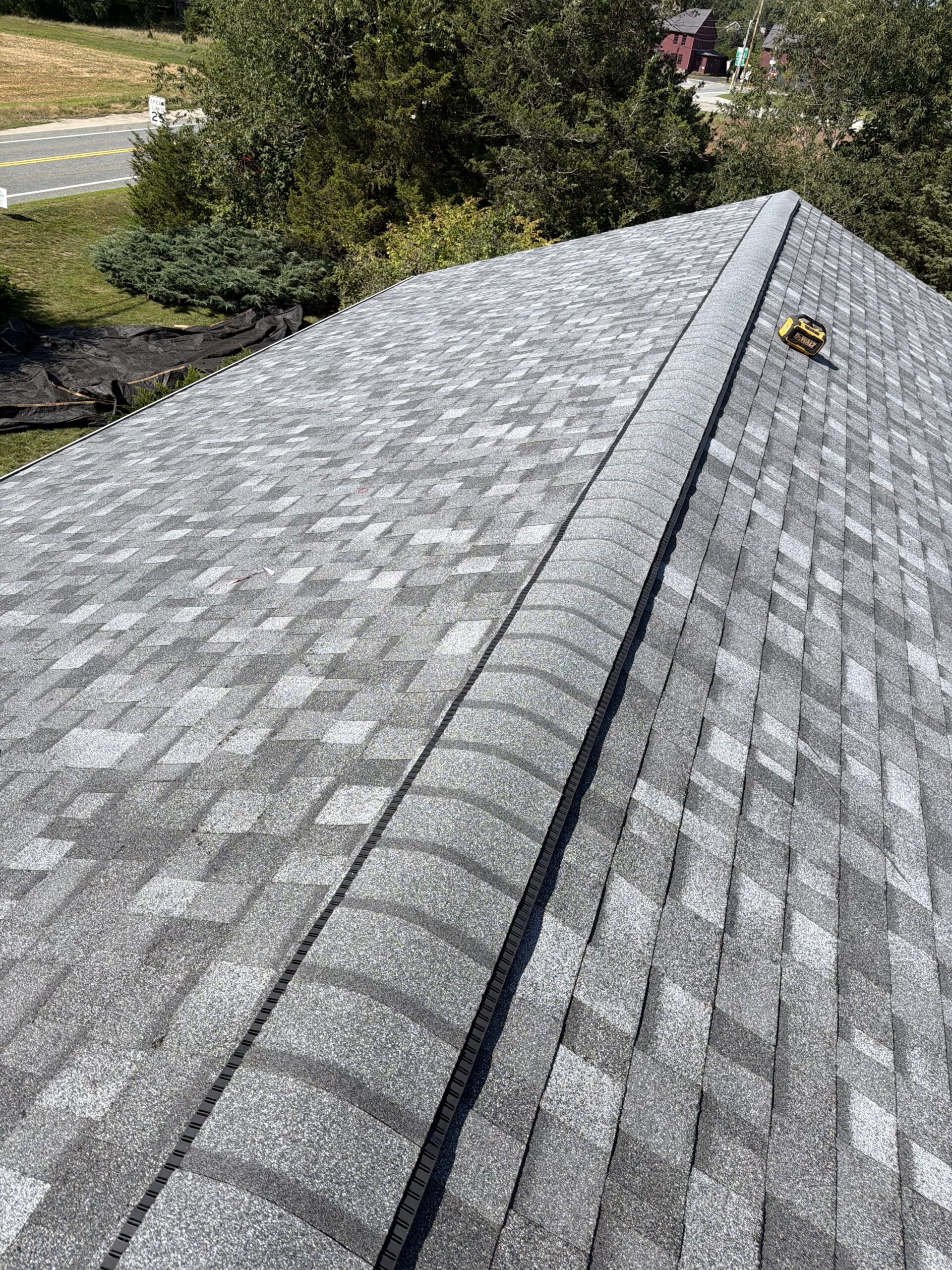 New architectural shingles and ridge vent installation