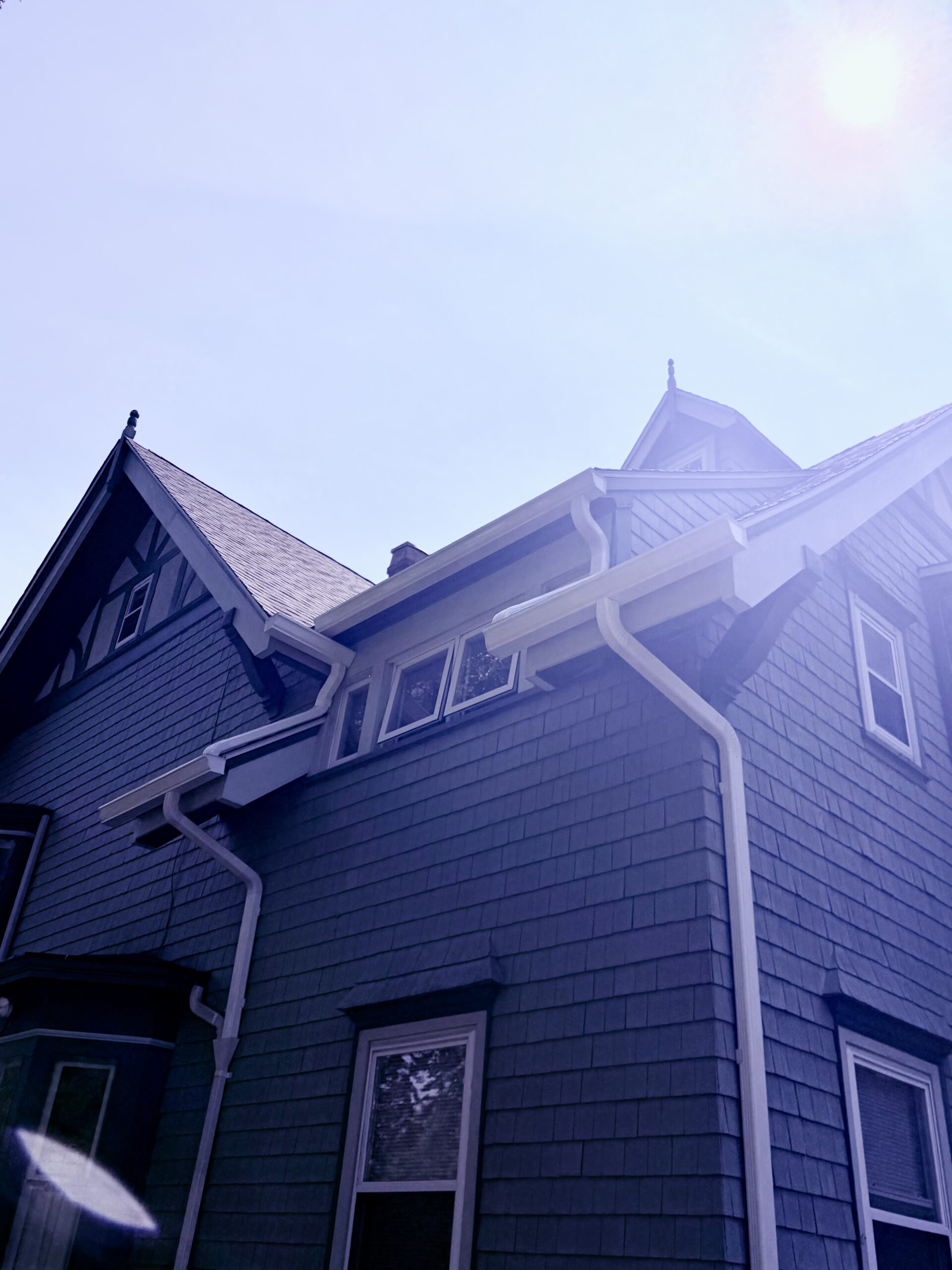New seamless gutter and downspout installation